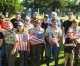 Scouts place flags on veteran’s graves