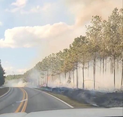 Large forest fire Tuesday closes highway, VFDs protecting structures